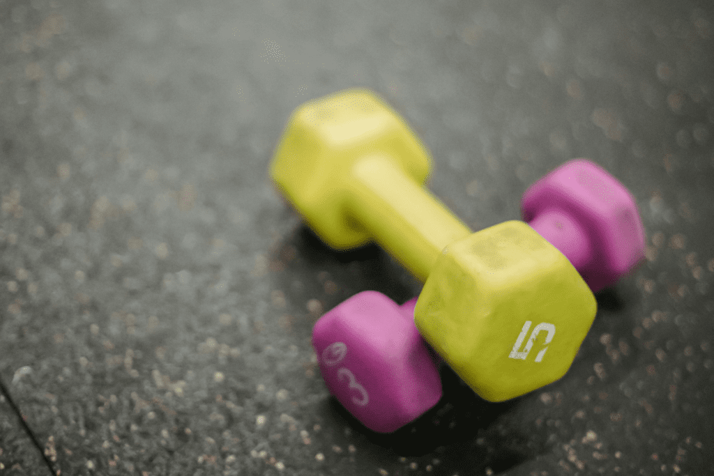 Dumbbells lying on rubber flooring